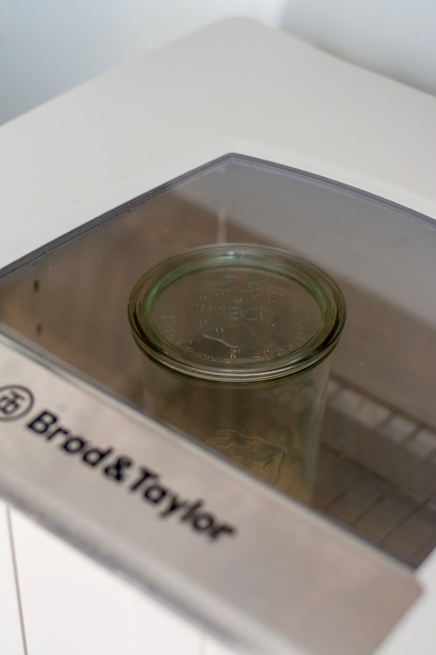 Jar of sourdough starter in proofer