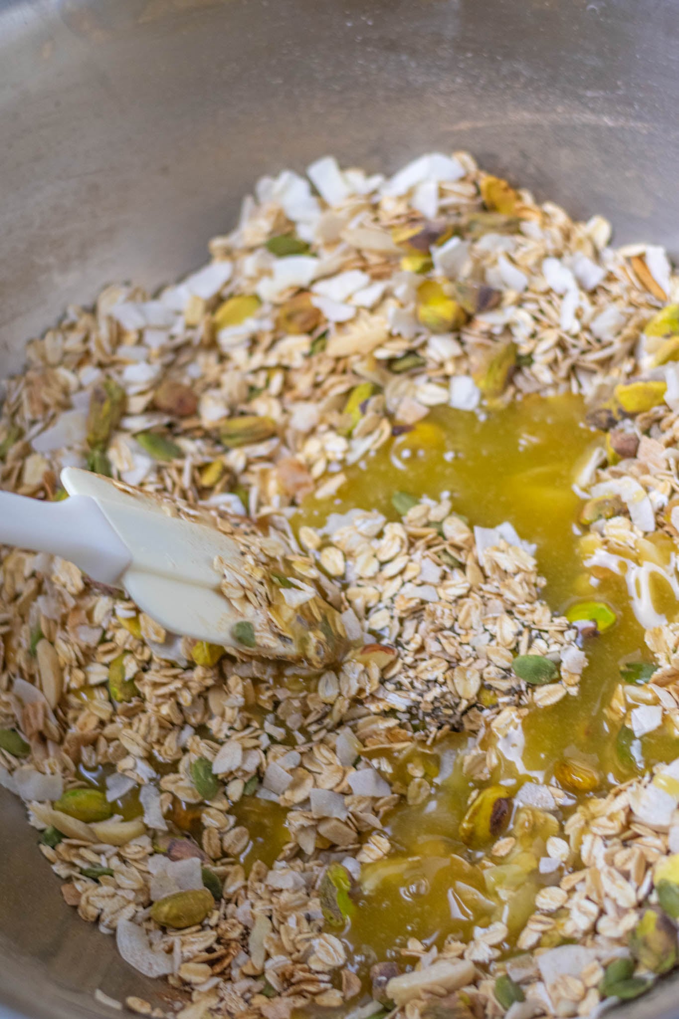 Mixing bowl with liquid ingredients just poured into dry ingredients before being stirred