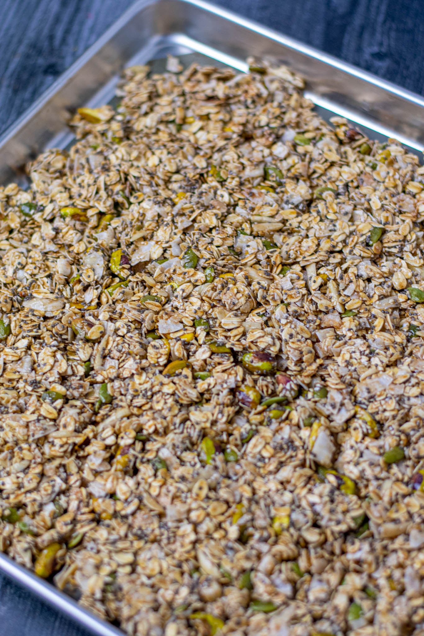 Unbaked sourdough discard granola on half sheet pan