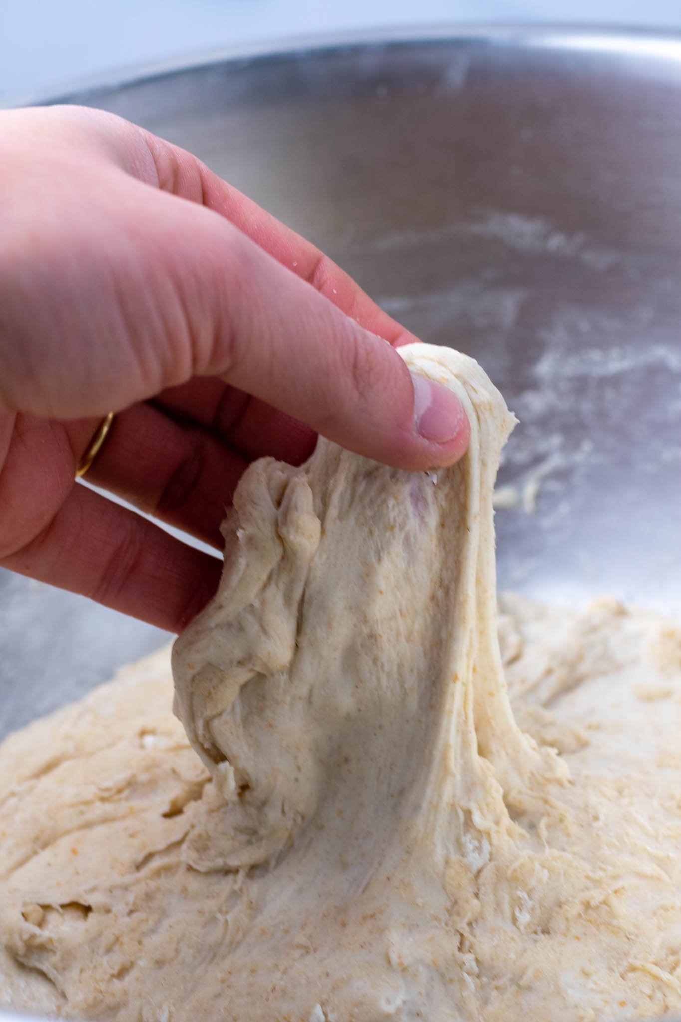 Hand stretching dough after autolyse