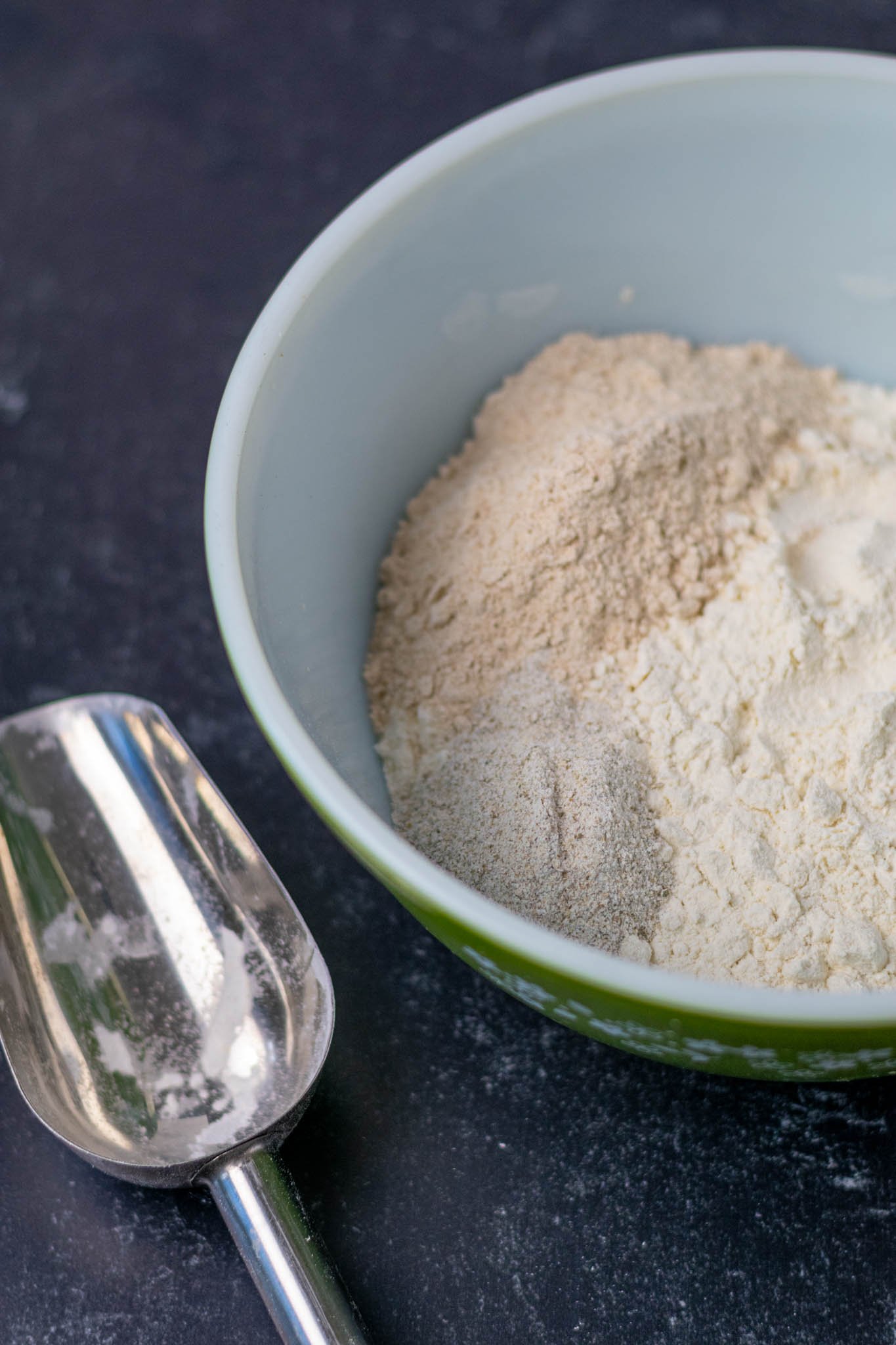 Bread flour, whole wheat flour, and rye flour in mixing bowl