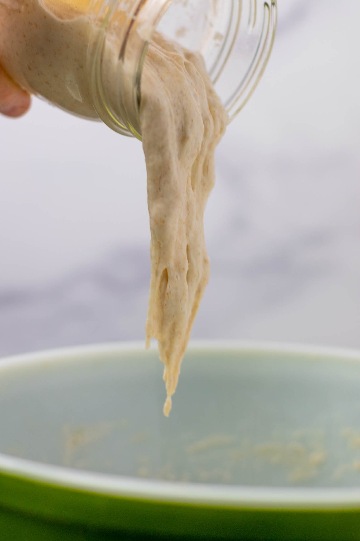 Levain dripping into mixing bowl