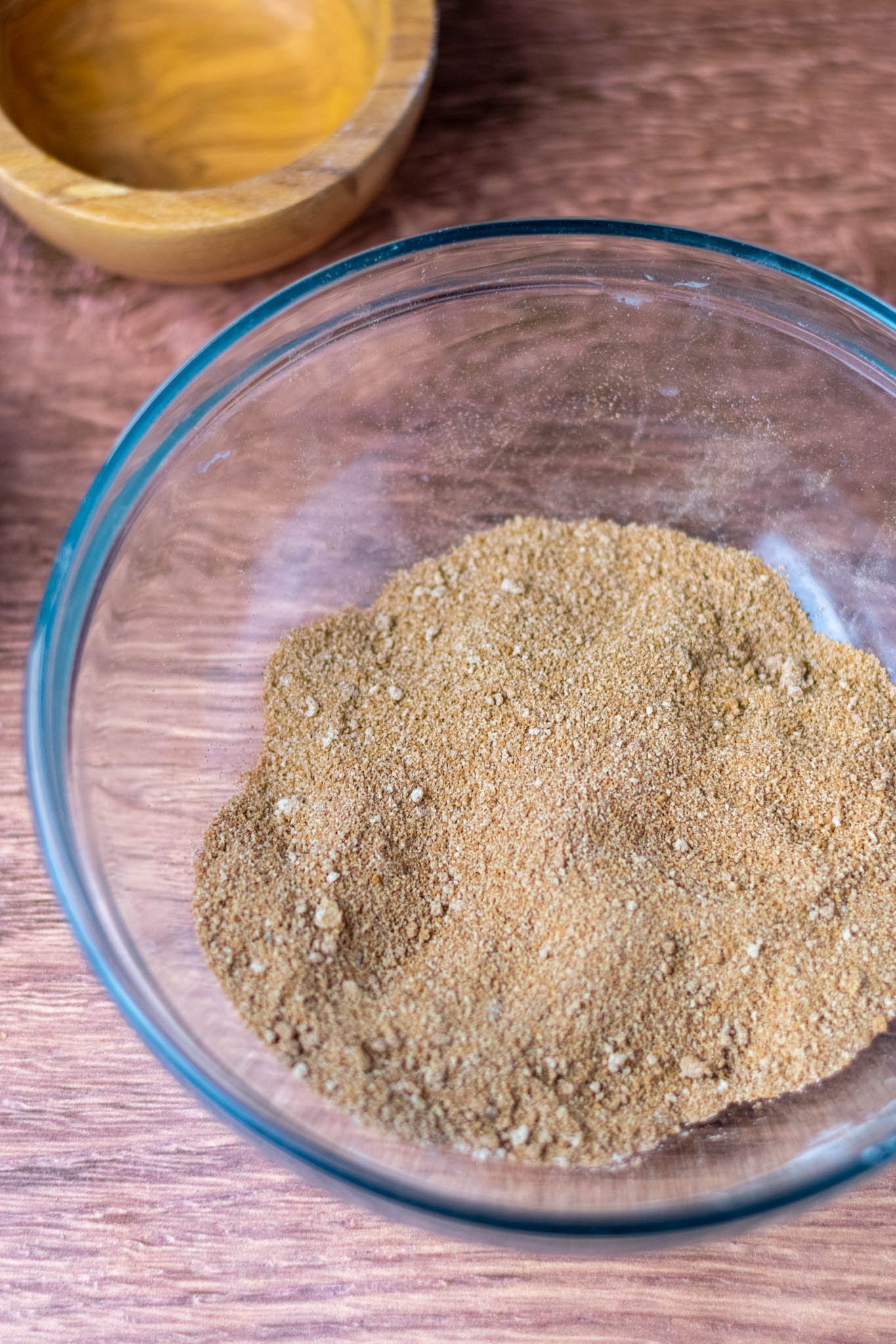 Glass bowl of cinnamon, sugar, and flour mixed together