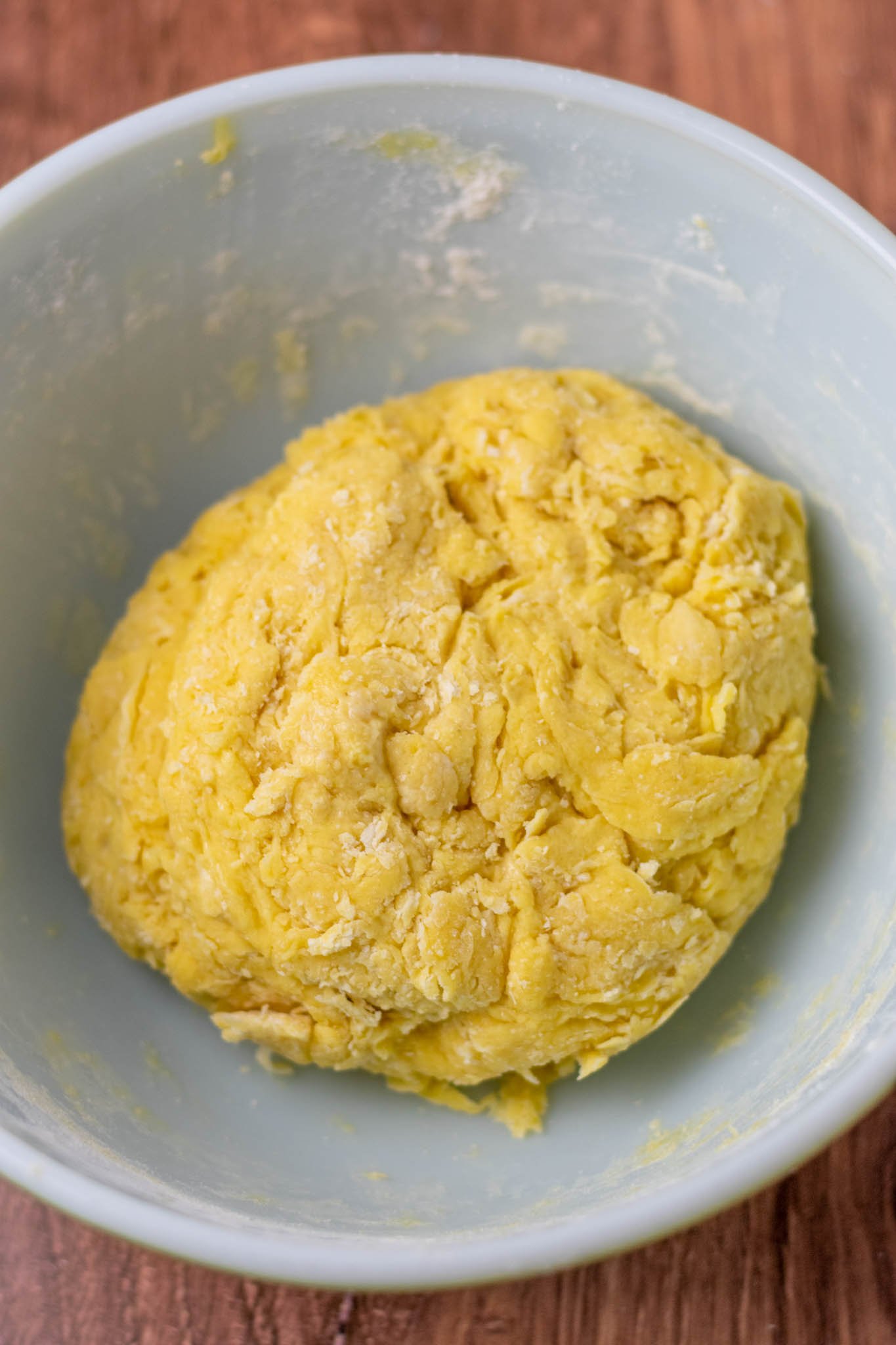 Mixed sourdough challah ingredients in bowl