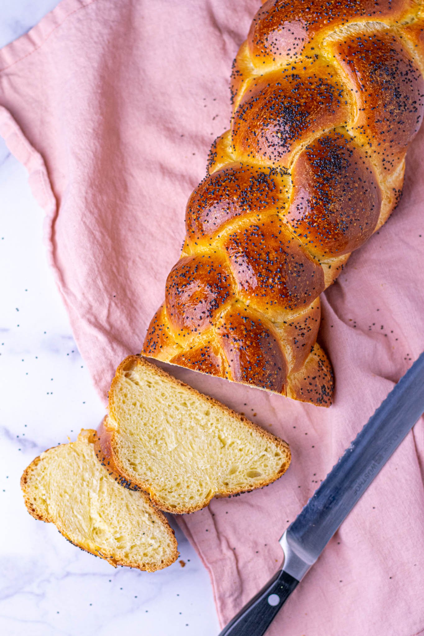 Sourdough challah poppy seeds pink towel