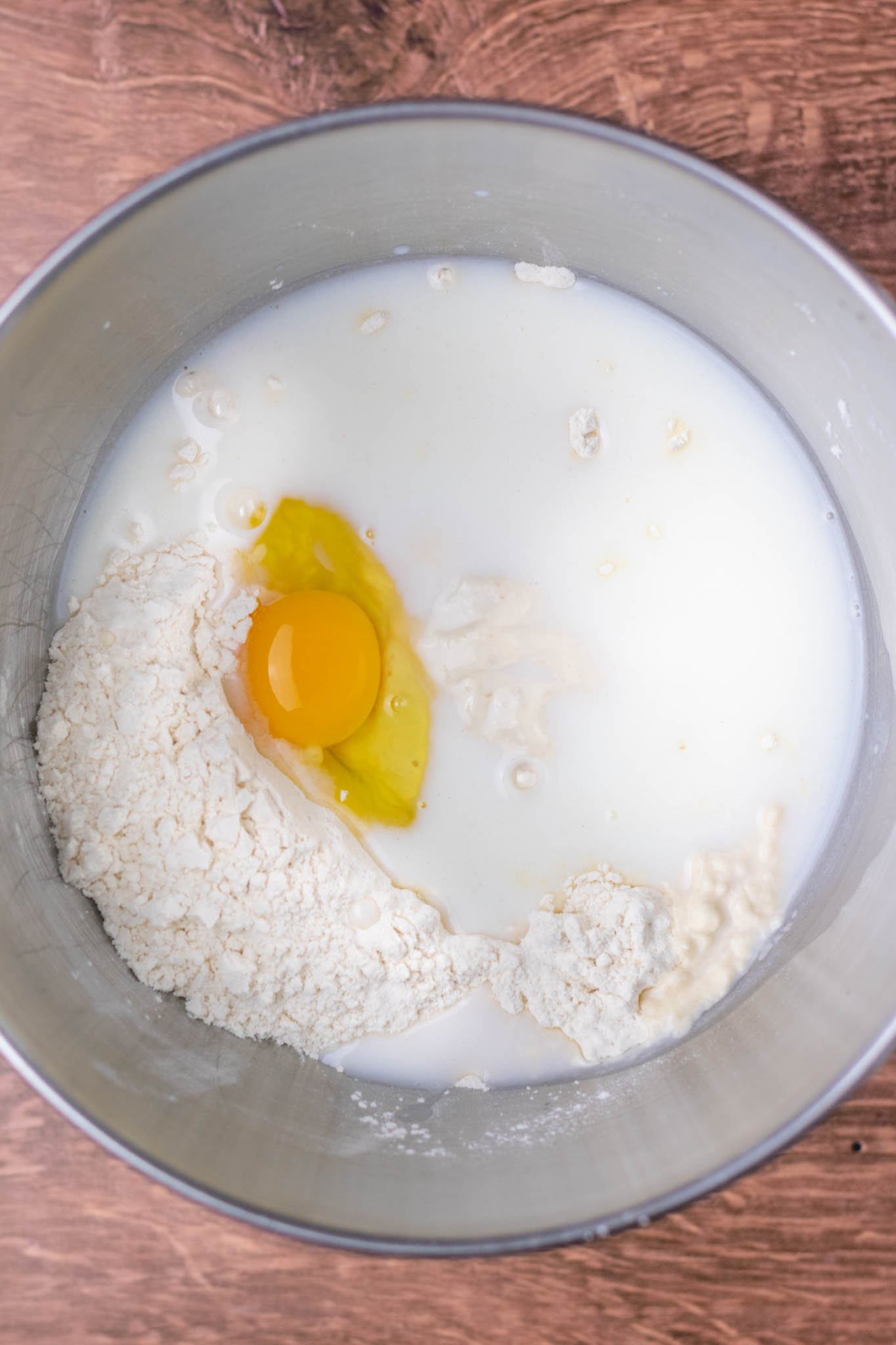 Overhead of wet and dry ingredients in bowl