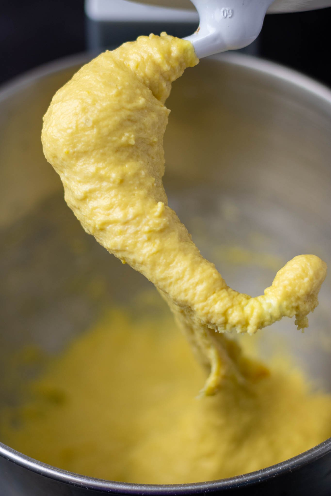 Brioche dough on dough hook after a few minutes of mixing