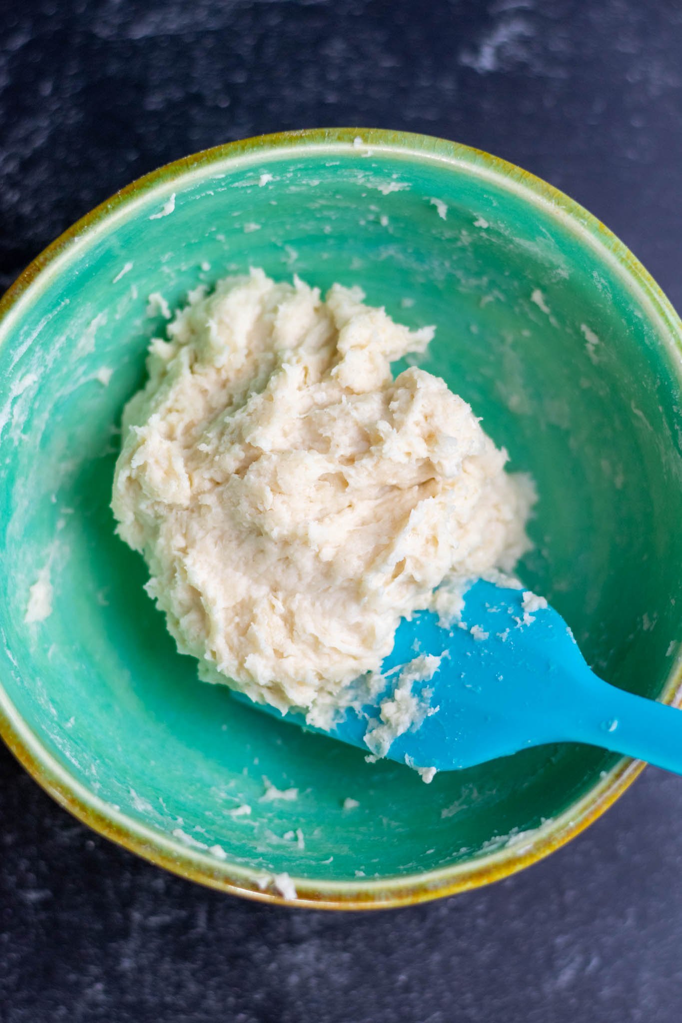 Mixed yudane in bowl with spatula