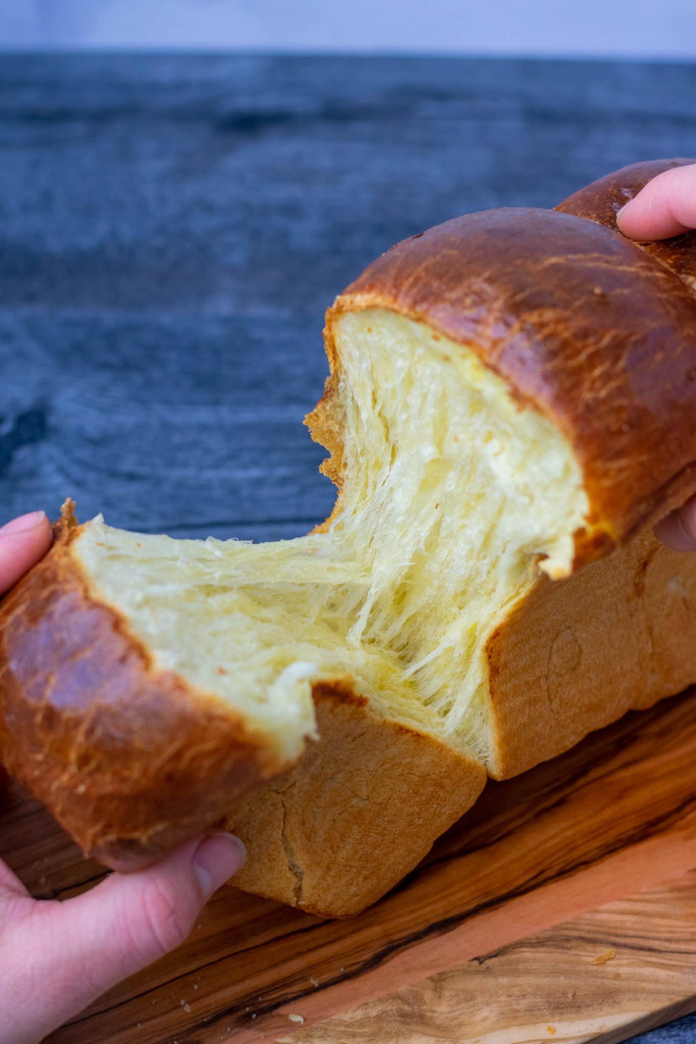 Overhead angle pulling apart sourdough brioche