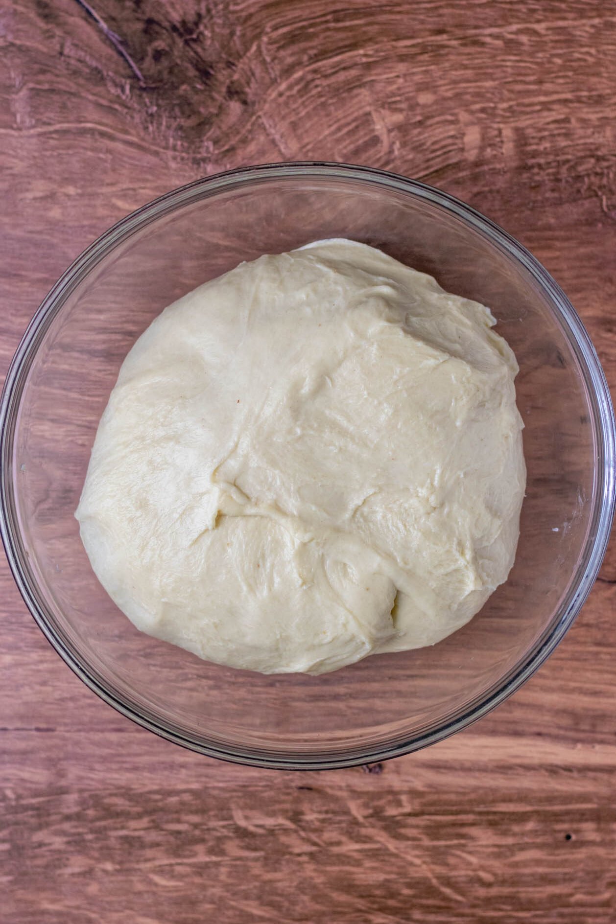 Overhead of dough in bowl at the start of bulk fermentation