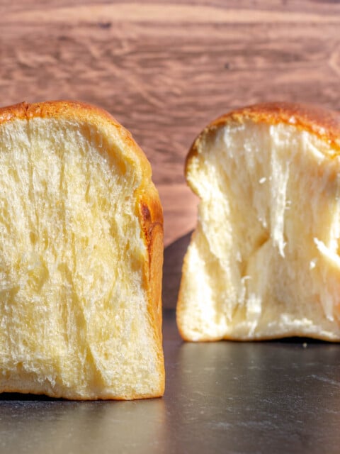 Crumbshot of sourdough brioche with loaf in background