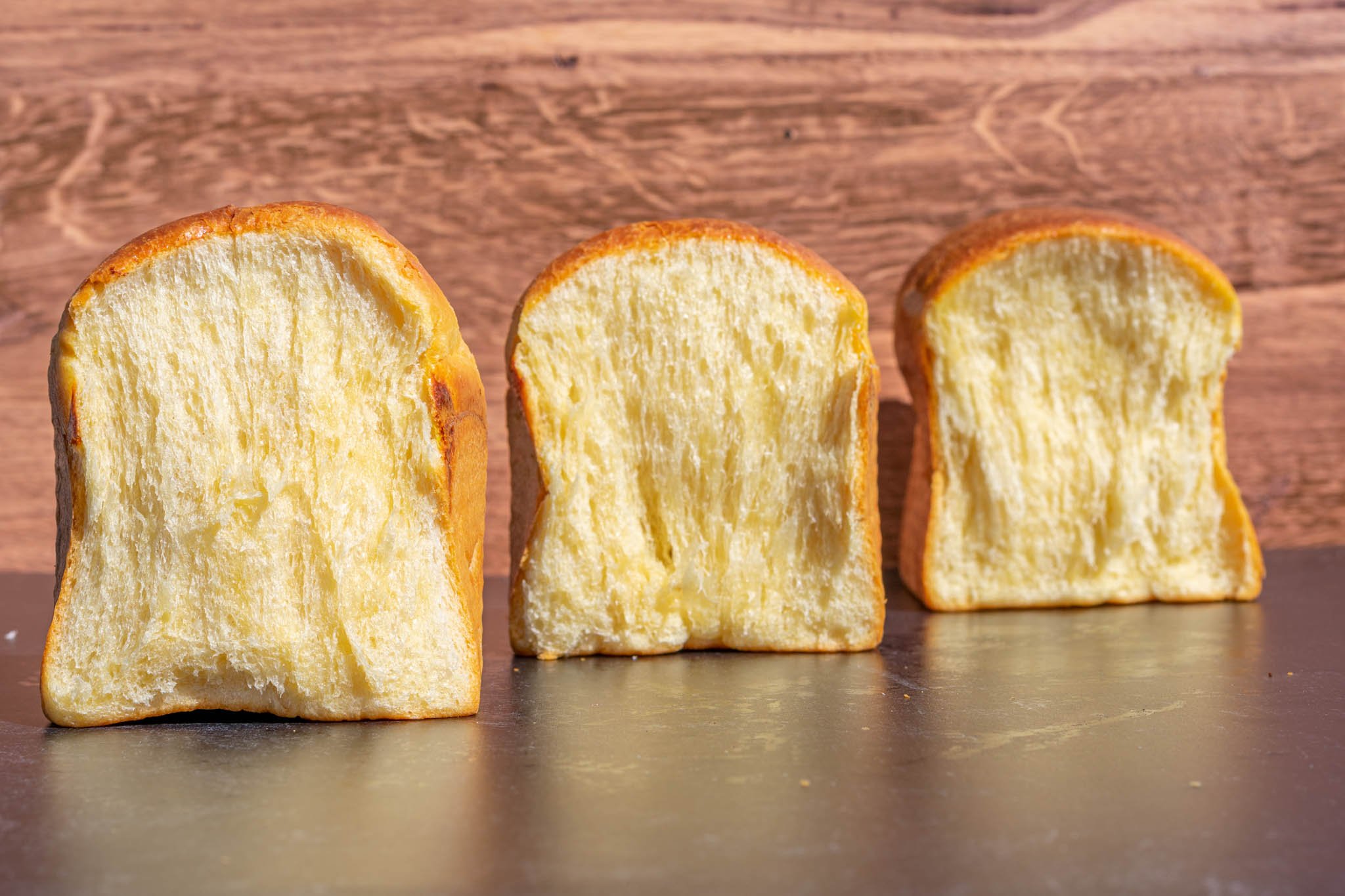 Crumbshots of three sourdough brioche lined up