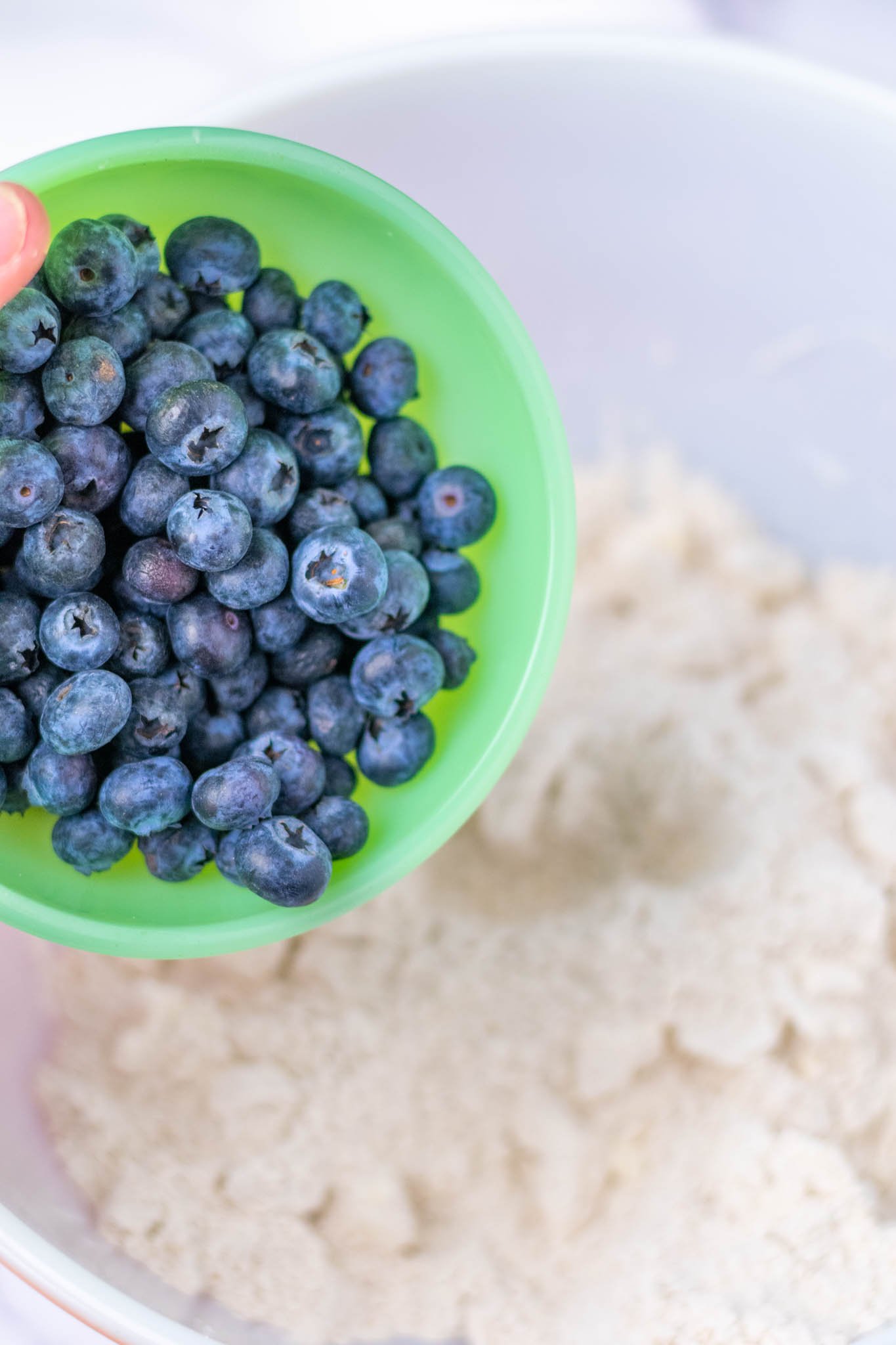 Bowl of blueberries before being added into bowl of dry ingredients
