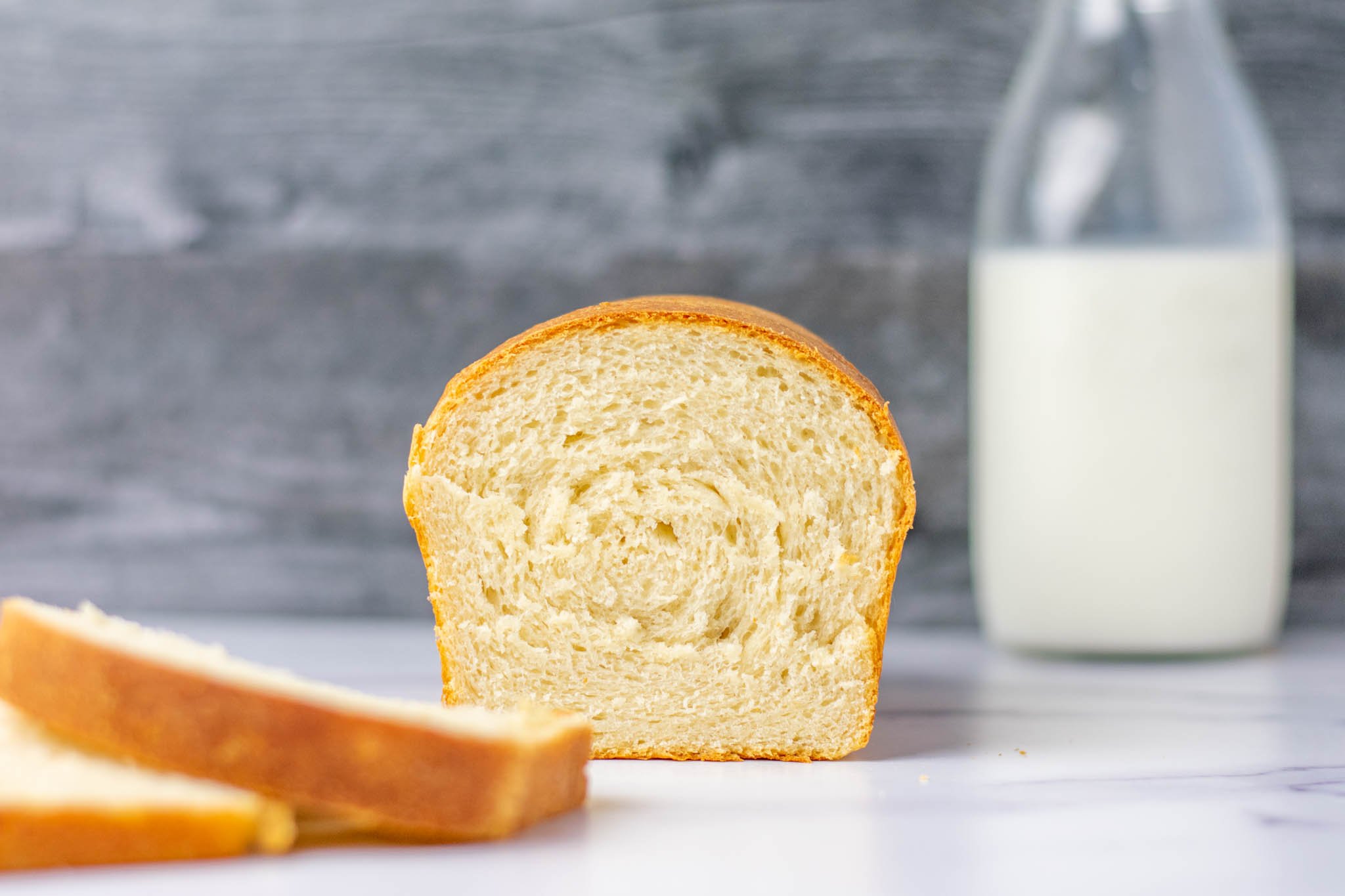 Sliced sourdough sandwich bread with milk