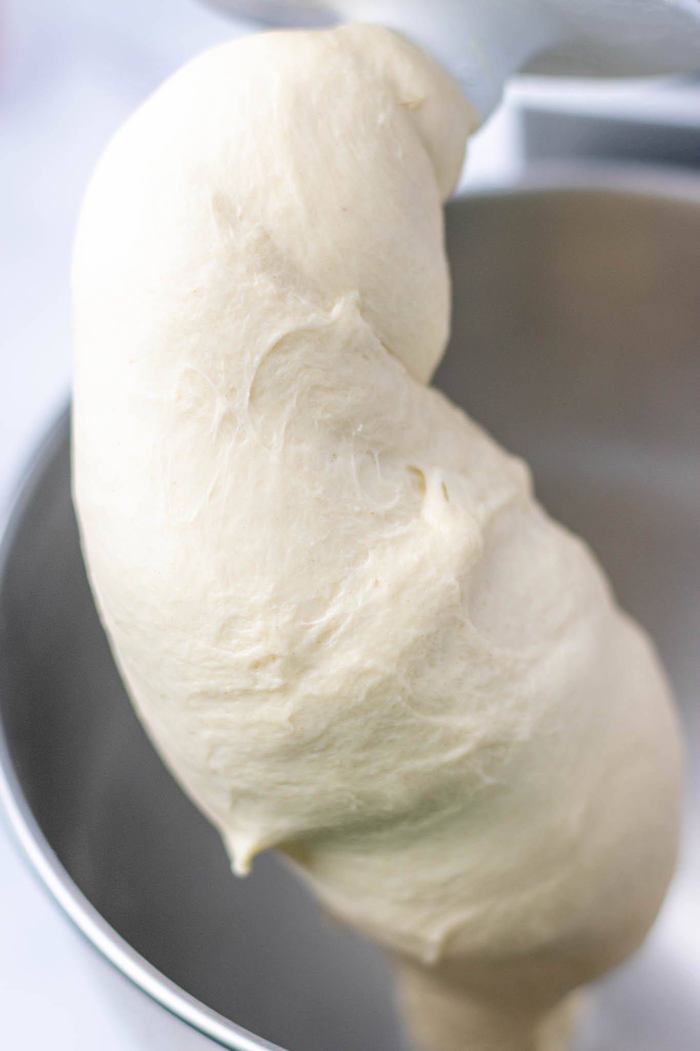 Smooth sourdough sandwich bread dough on dough hook