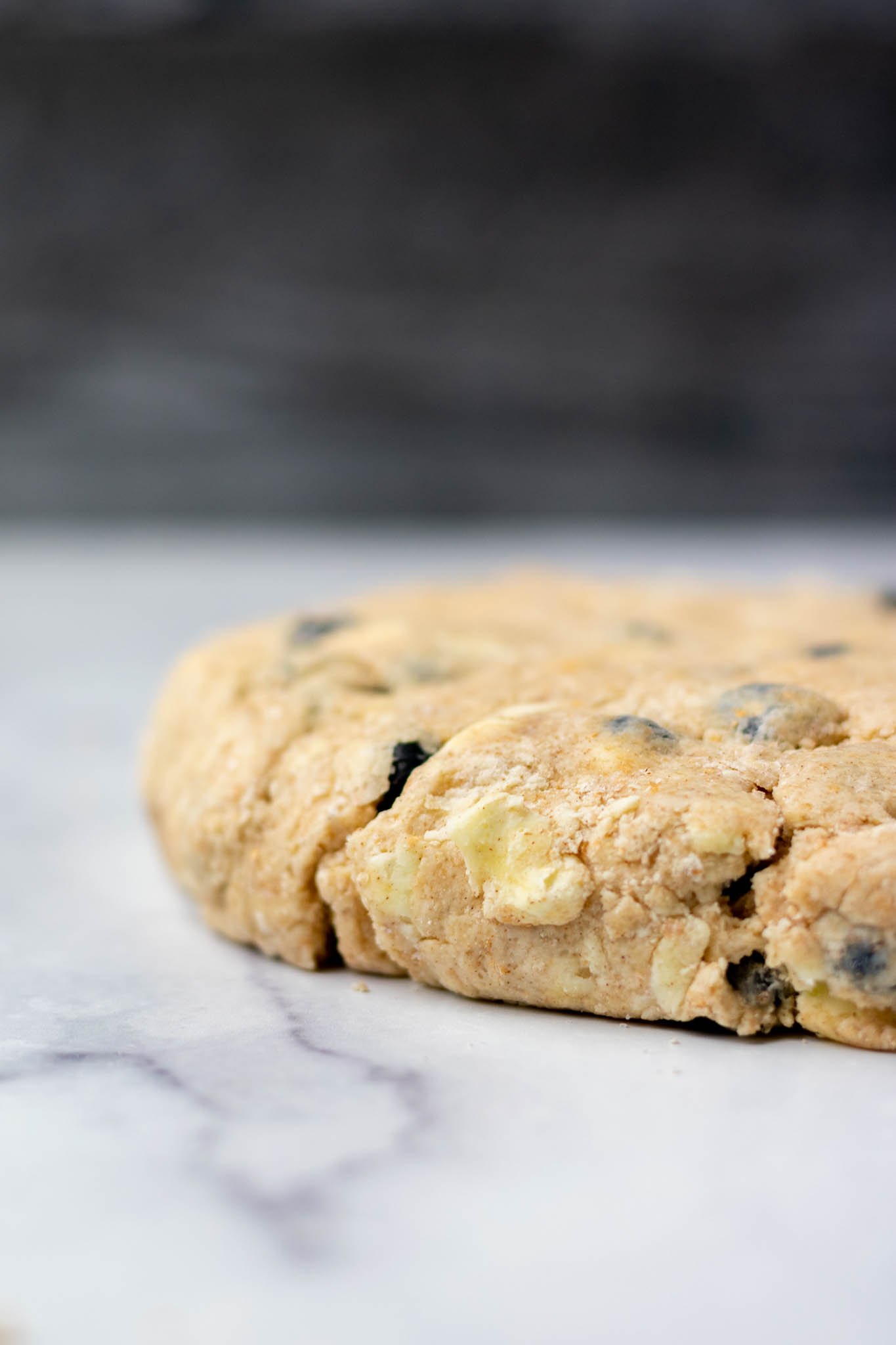 Sourdough discard blueberry scone dough on counter up close