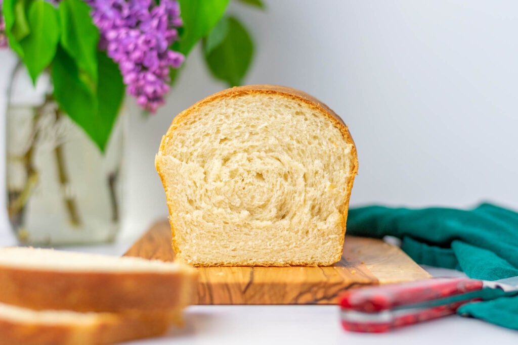 Sliced sourdough sandwich bread on serving platter