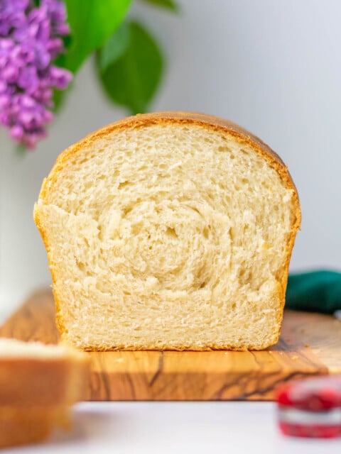 Sliced sourdough sandwich bread on serving platter