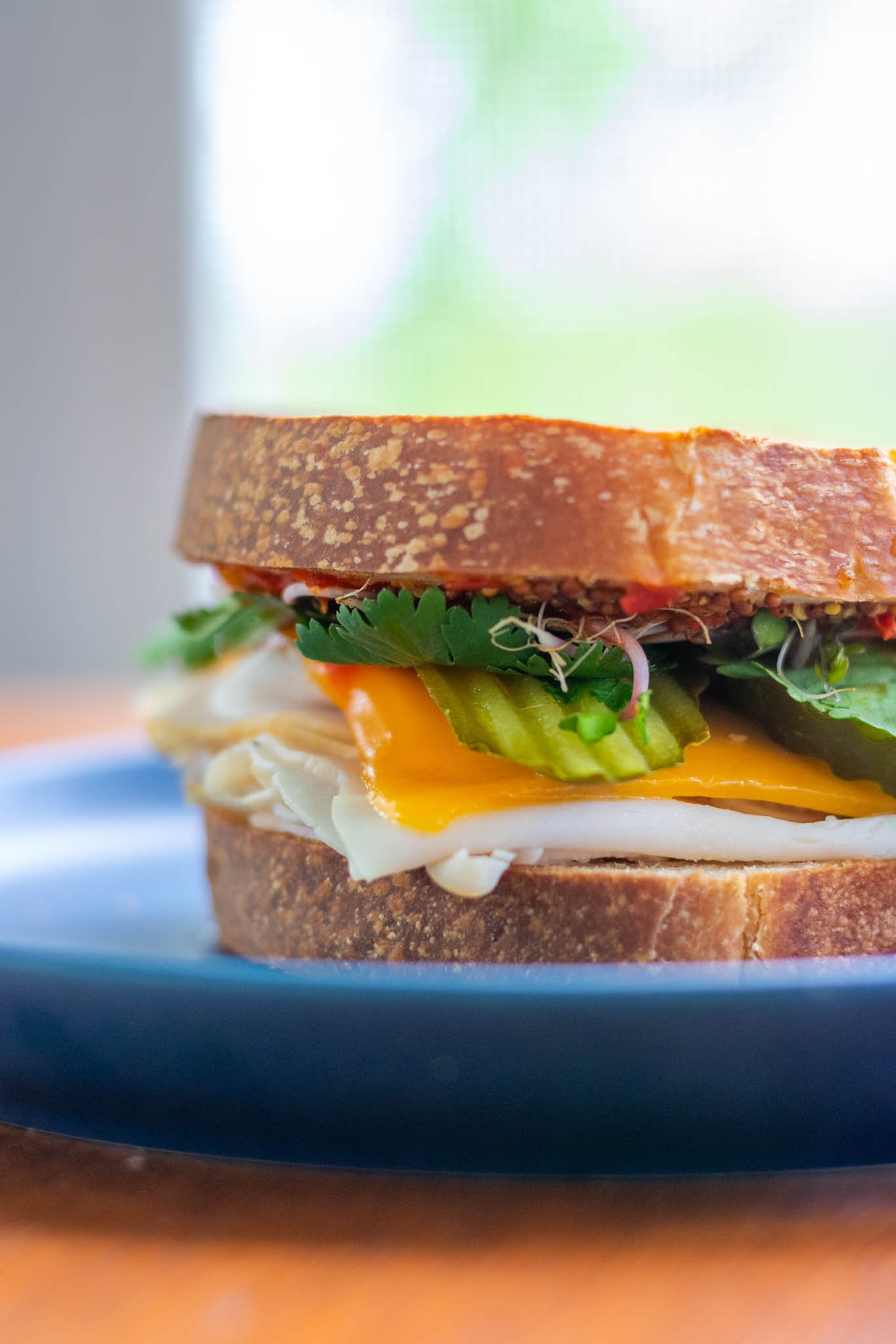 Turkey sandwich on plate using sourdough sandwich bread