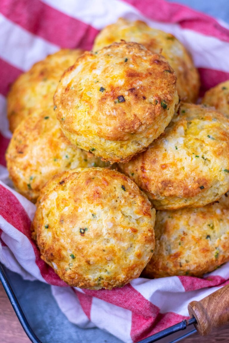 Sourdough biscuits in a basket with red and white towel