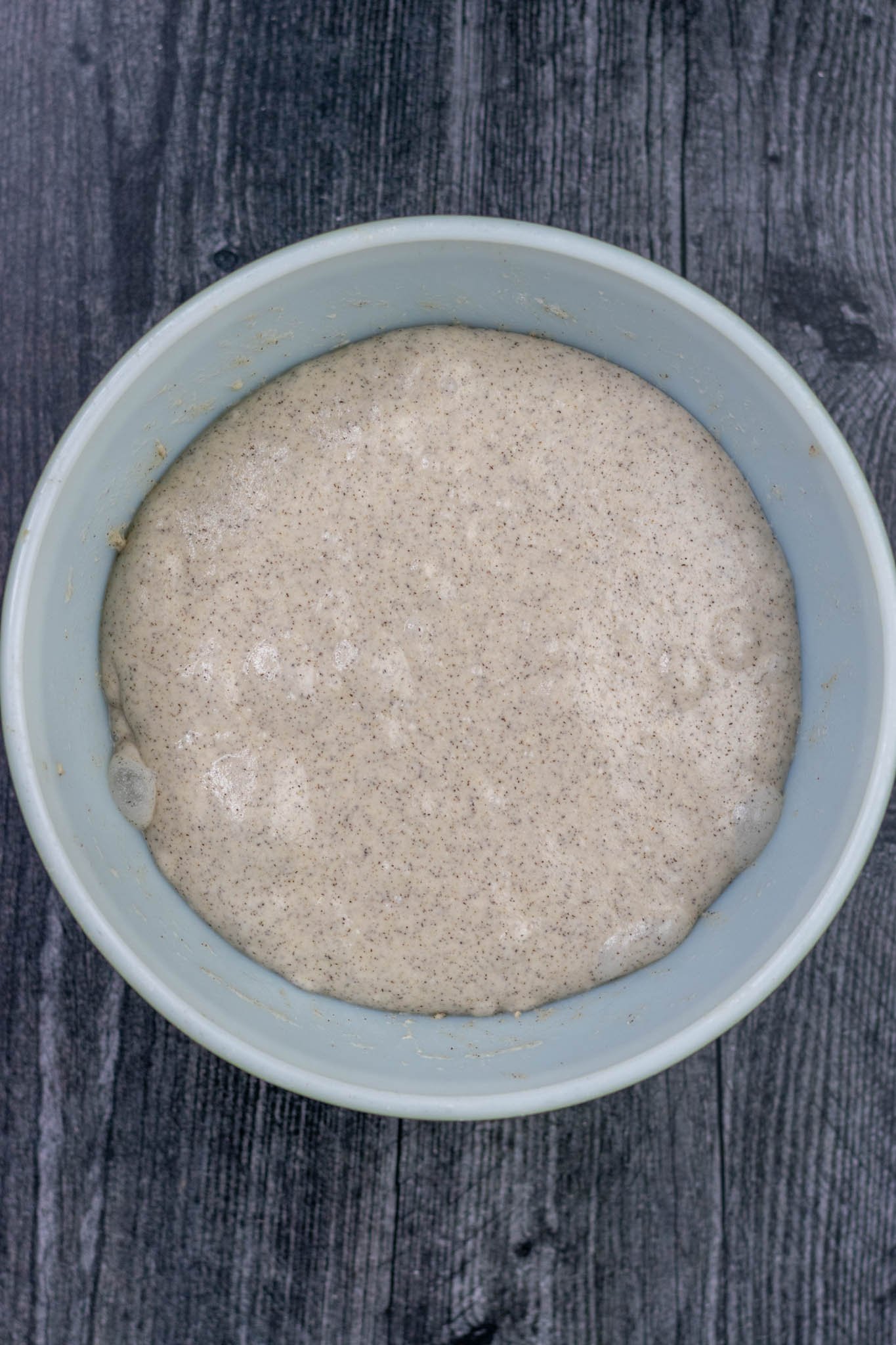 Buckwheat sourdough in bowl risen at end of bulk fermentation