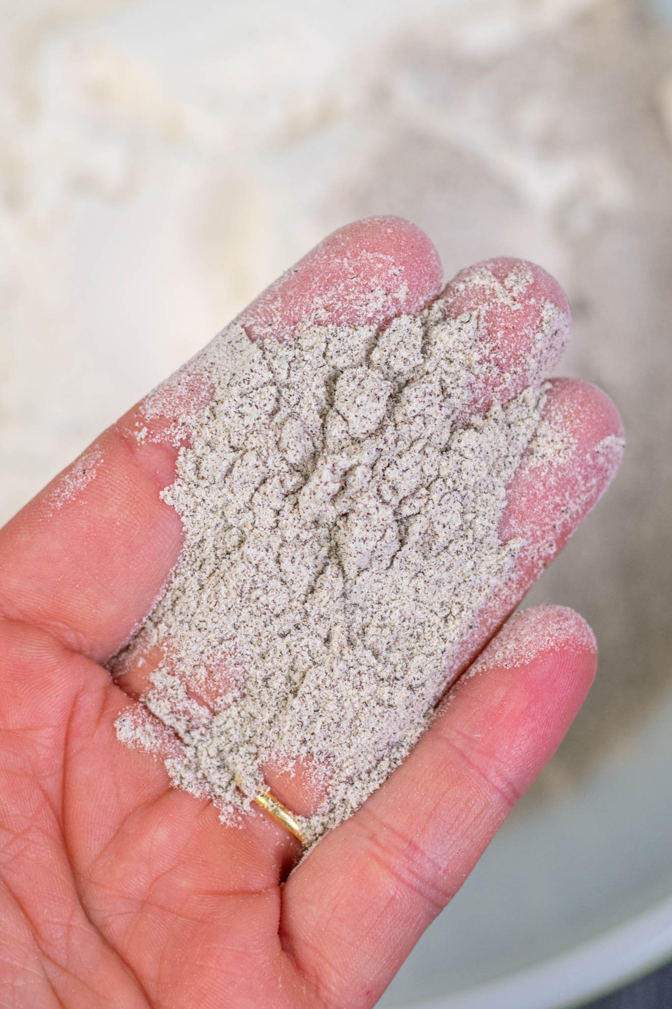 Hand holding buckwheat flour