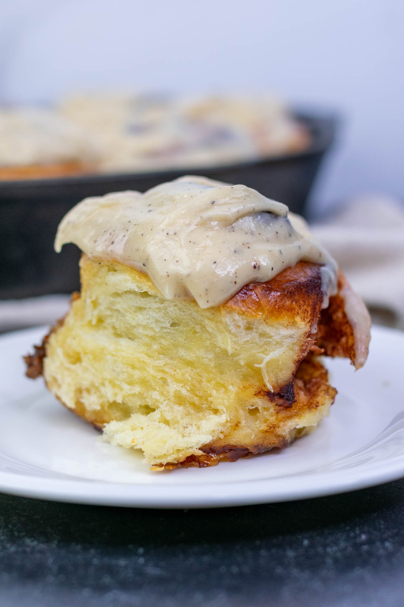 Interior of a sourdough cinnamon rolls made with brioche dough on a plate