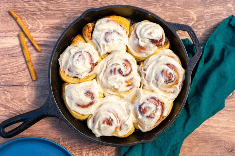 Sourdough Cinnamon Rolls with Cream Cheese Frosting in a Cast Iron Skillet