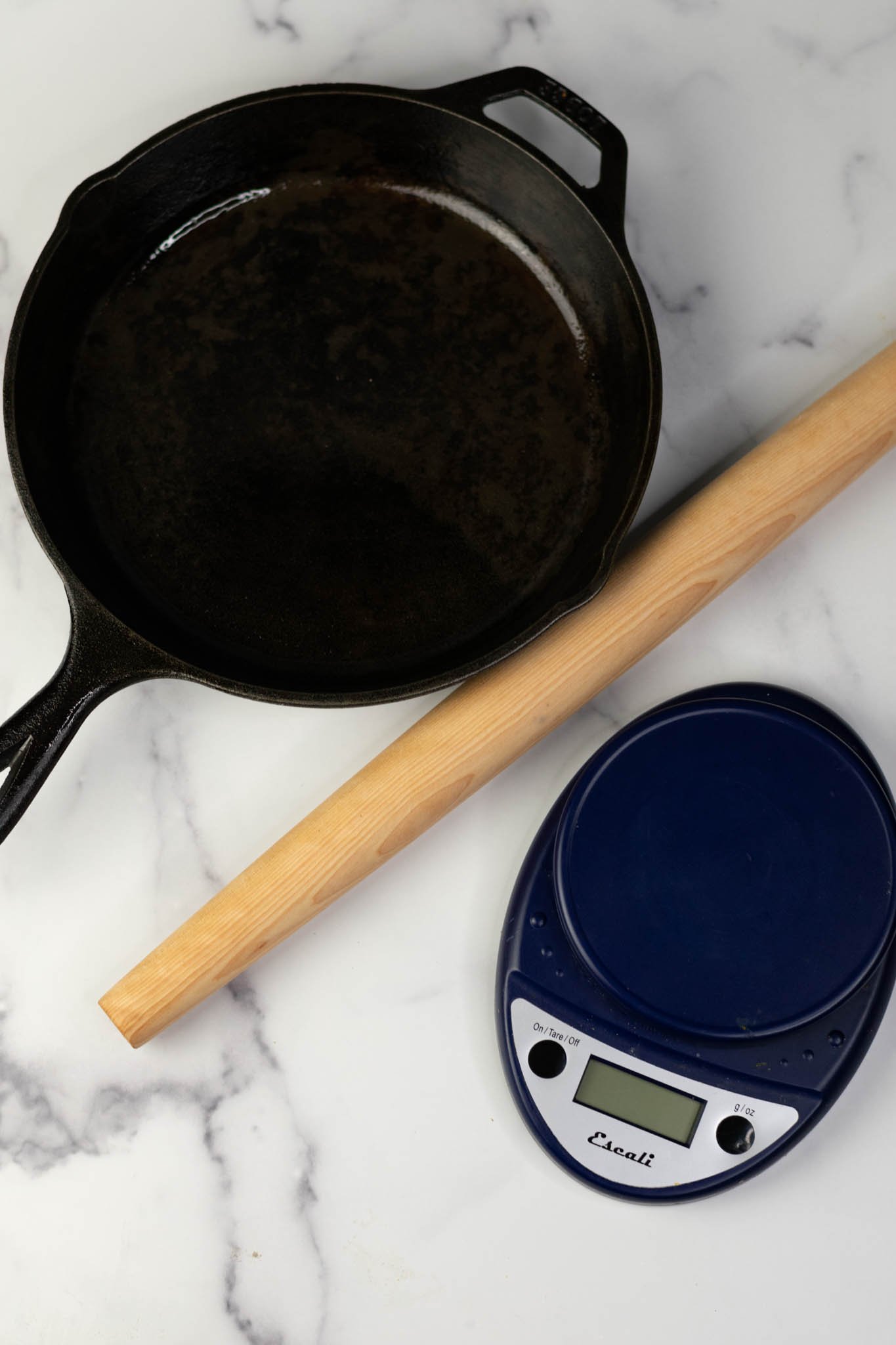 Cast iron skillet, rolling pin, and baking scale