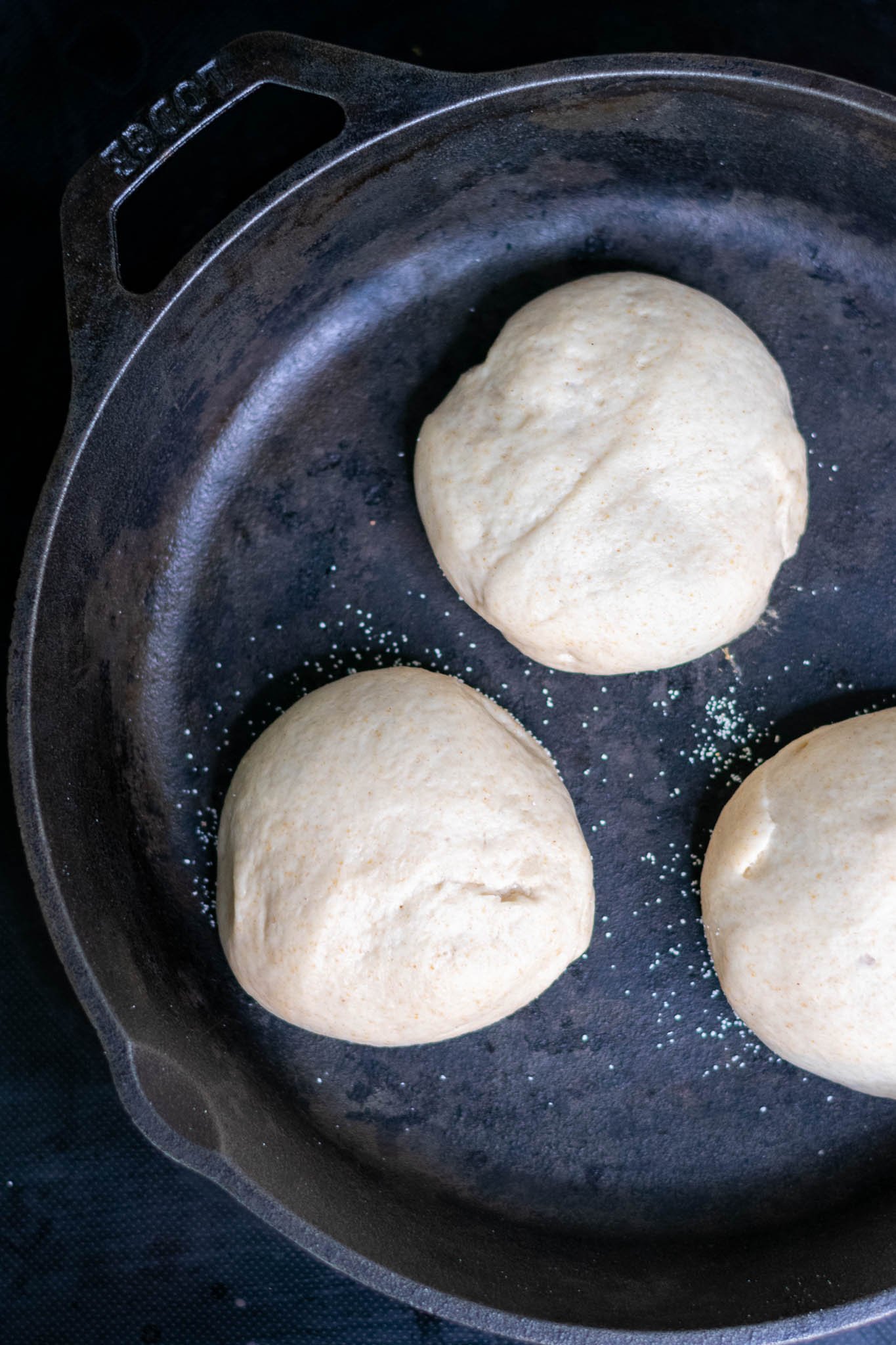 Griddling sourdough english muffins in cast iron skillet