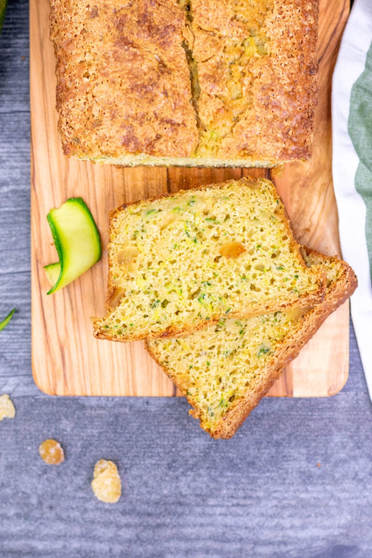 Two slices of sourdough zucchini bread on table