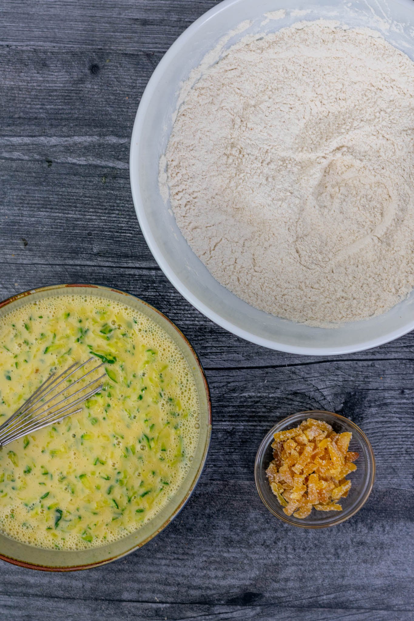 Bowls of dry ingredients, wet ingredients, and crystallized ginger
