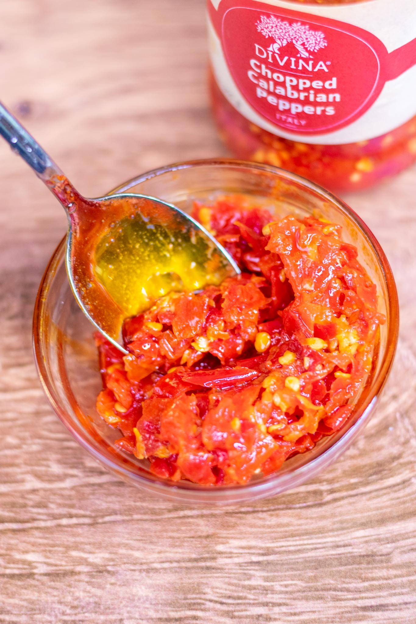 Bowl of calabrian chilis with spoon