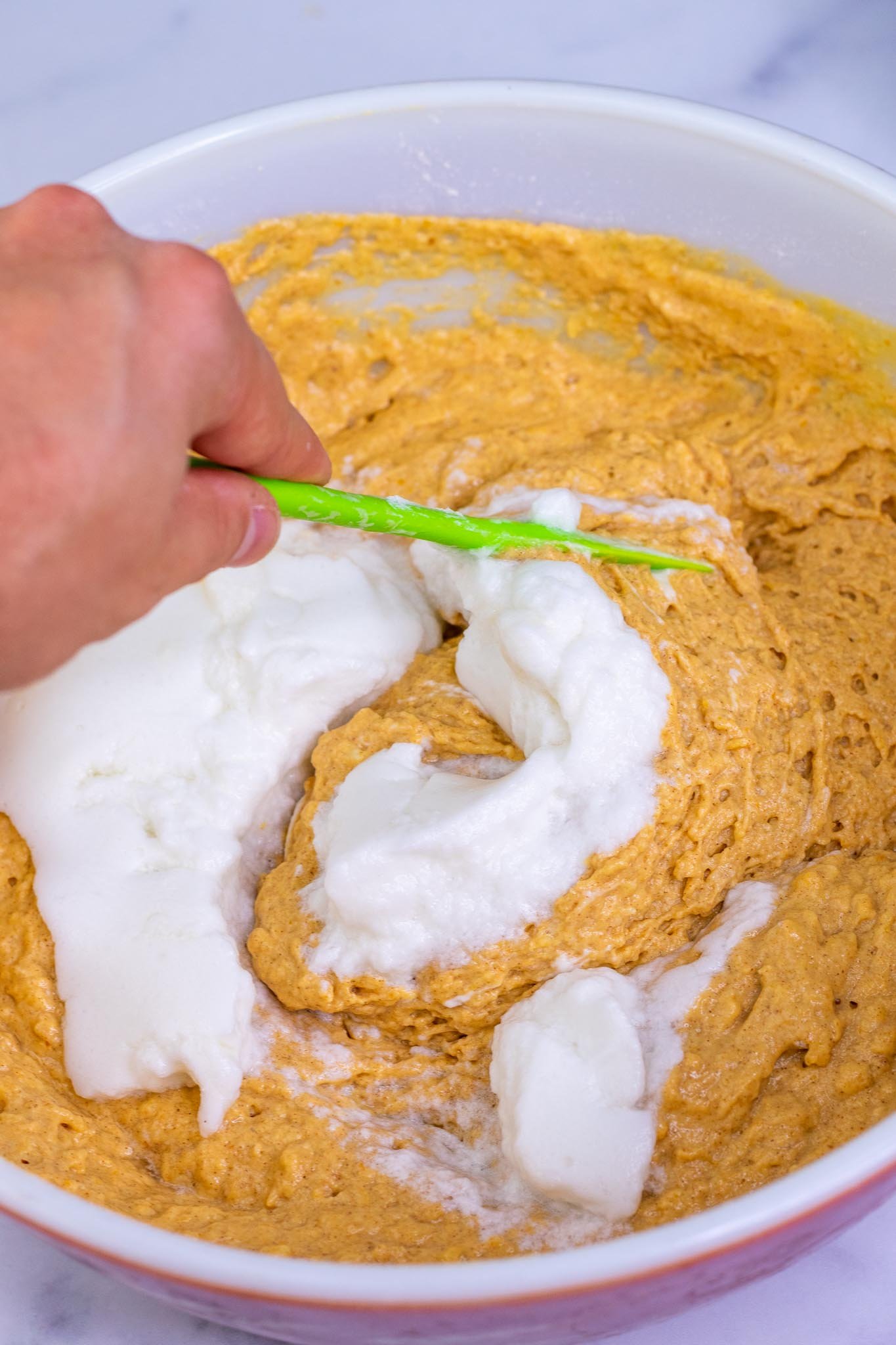 Folding in egg whites into Sourdough Pumpkin Waffle batter