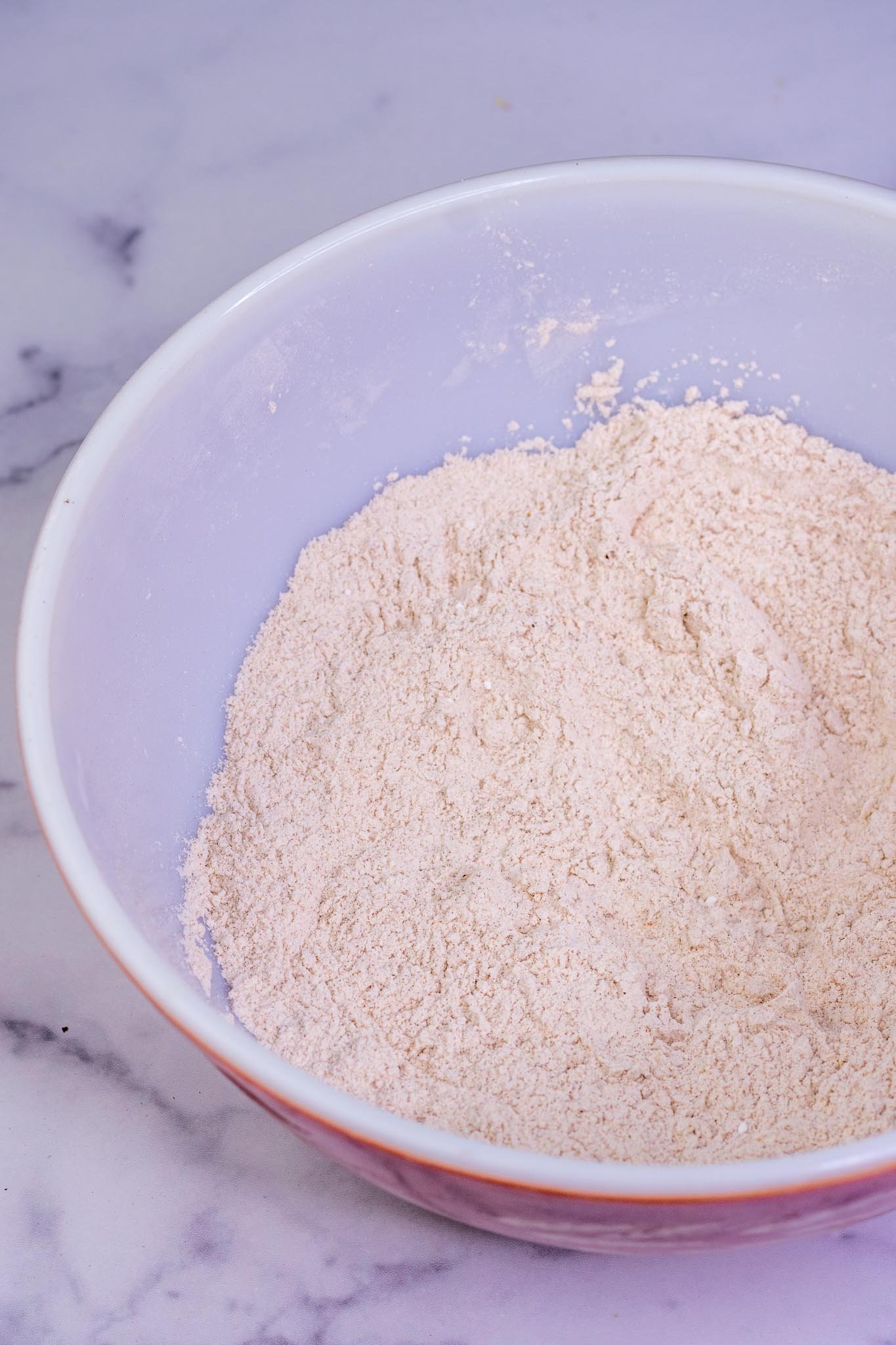 Mixed dry ingredients for Sourdough Pumpkin Waffles in bowl