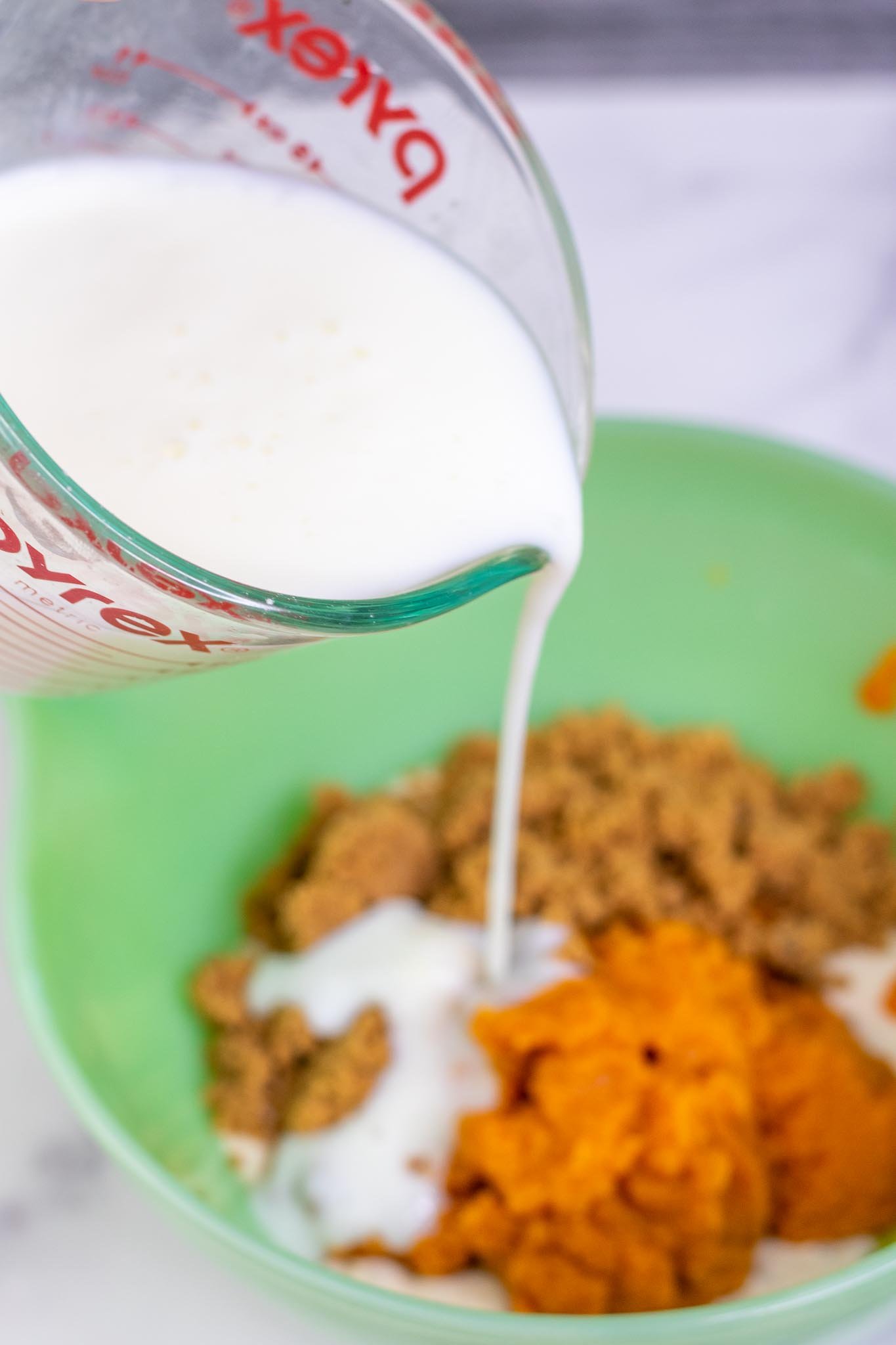Pouring buttermilk into wet ingredient bowl