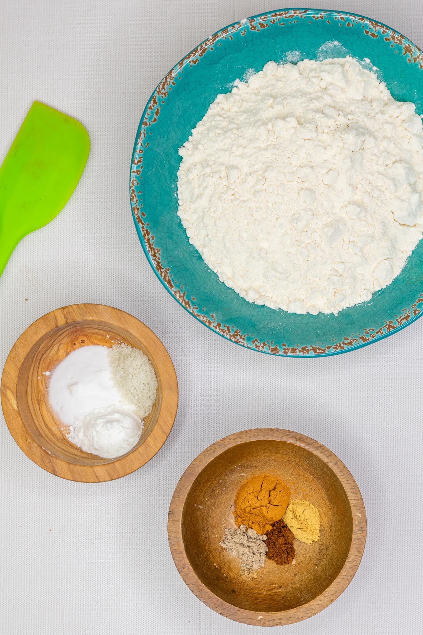 Dry ingredients for apple butter muffins including flour, salt, baking powder, baking soda, and spices