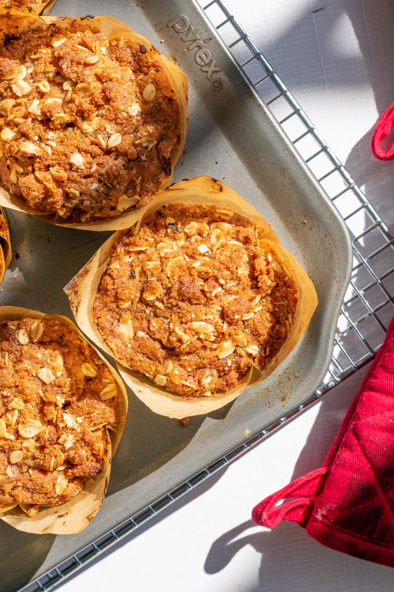 sourdough apple butter muffins cooling on wire rack