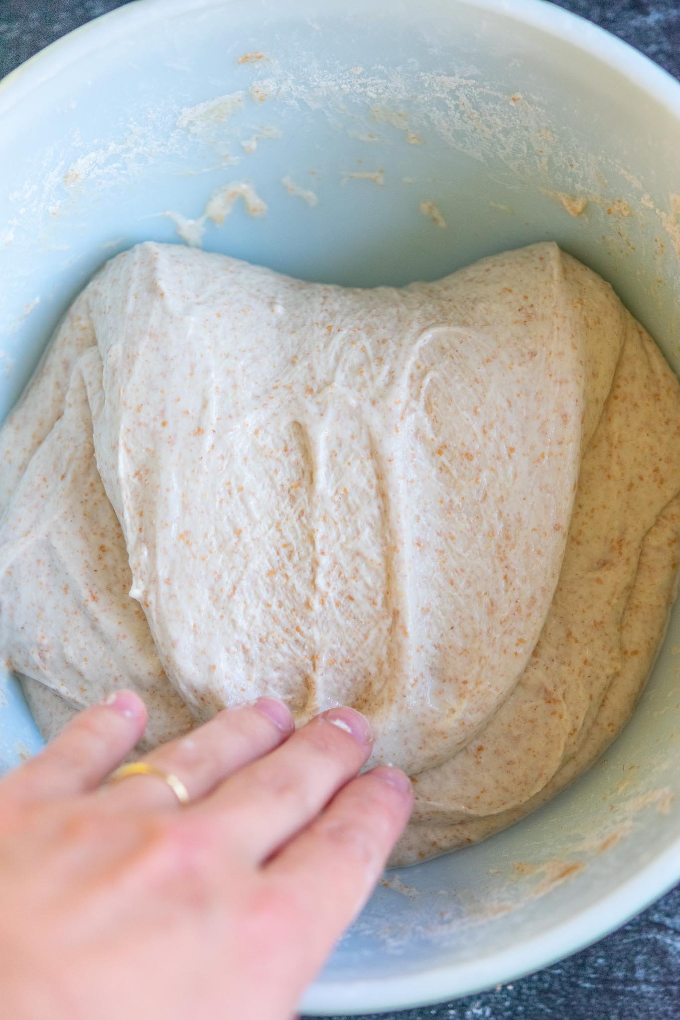 Folding down dough onto itself