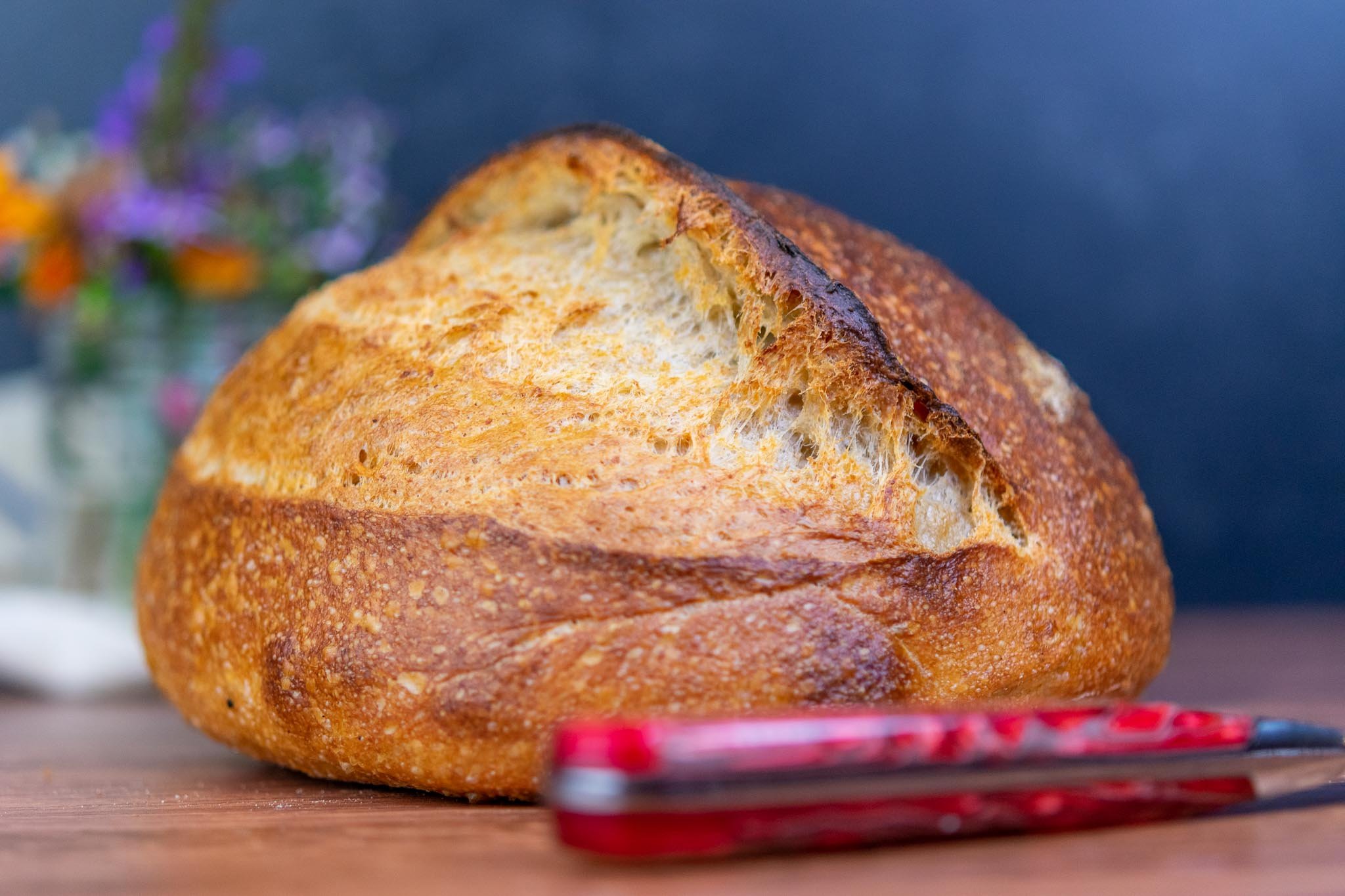 Loaf of spelt sourdough bread with bread knife