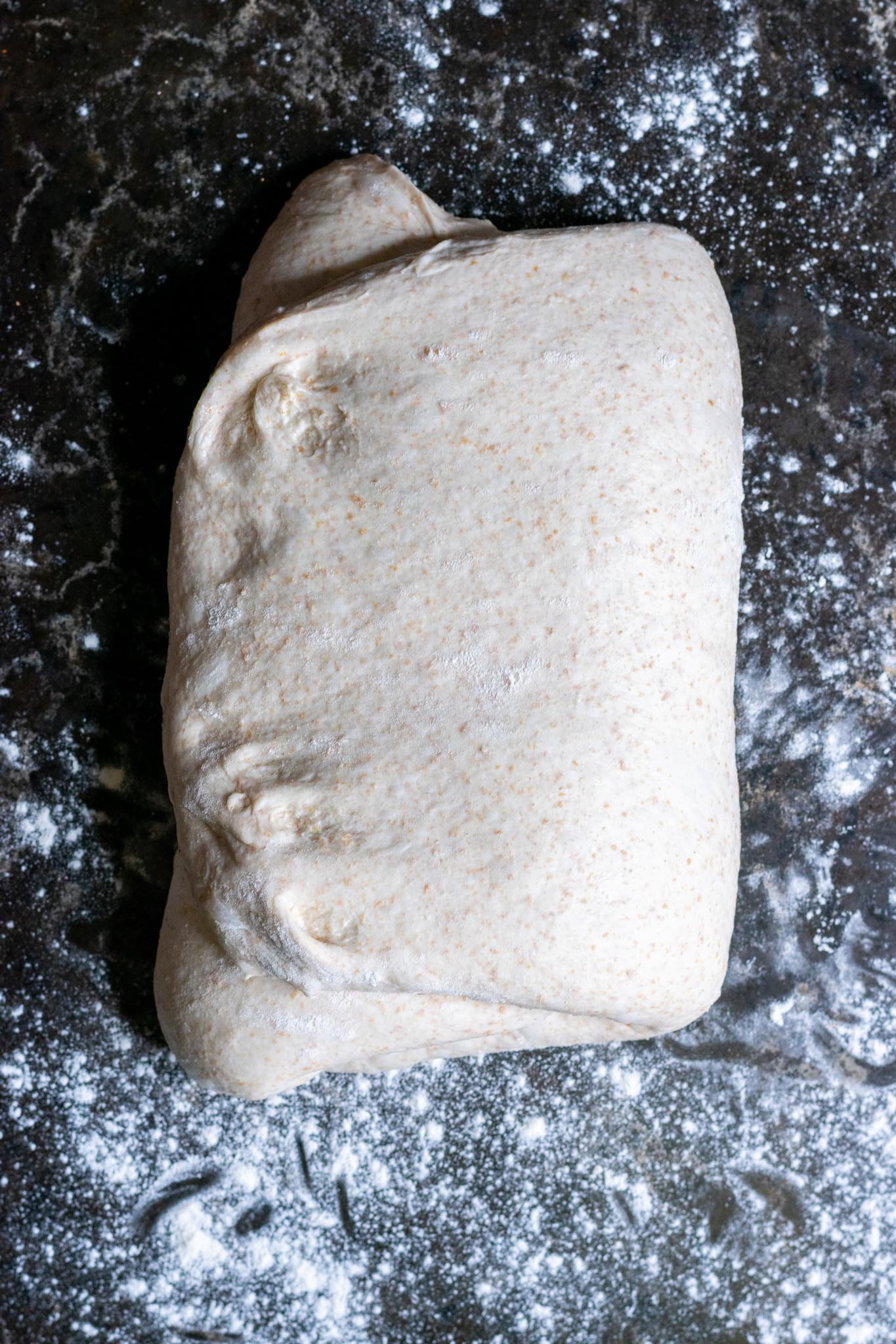 Folding dough into an envelop with right side folded over