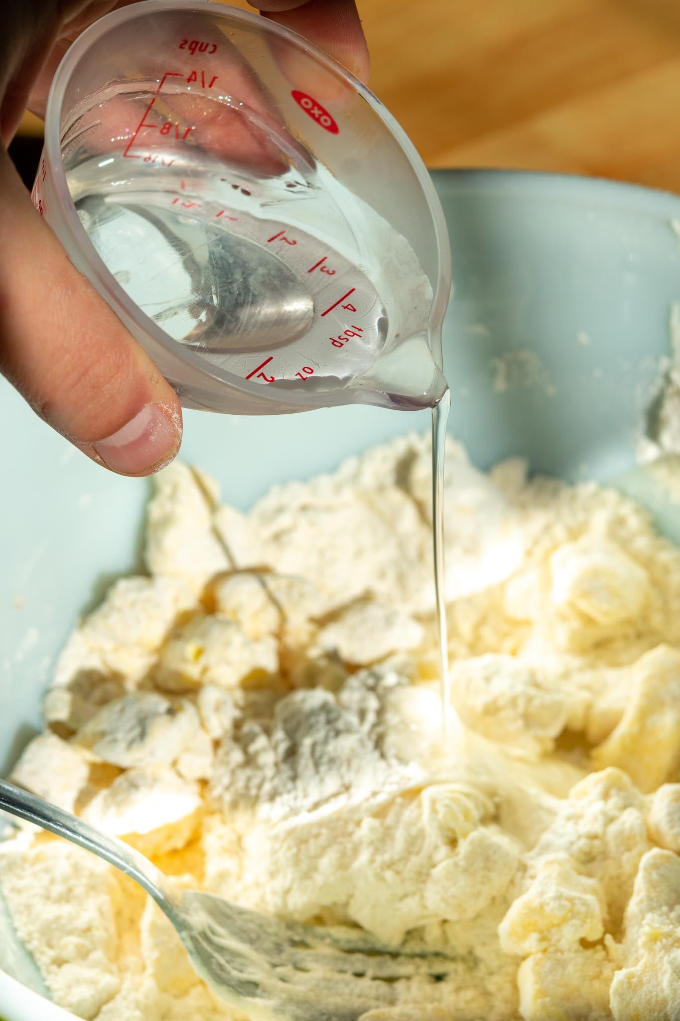 Pouring ice water into bowl