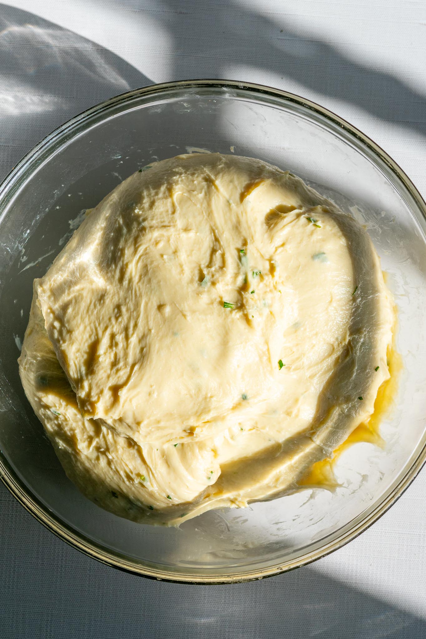 Dinner roll dough in a bowl at the start of bulk fermentation