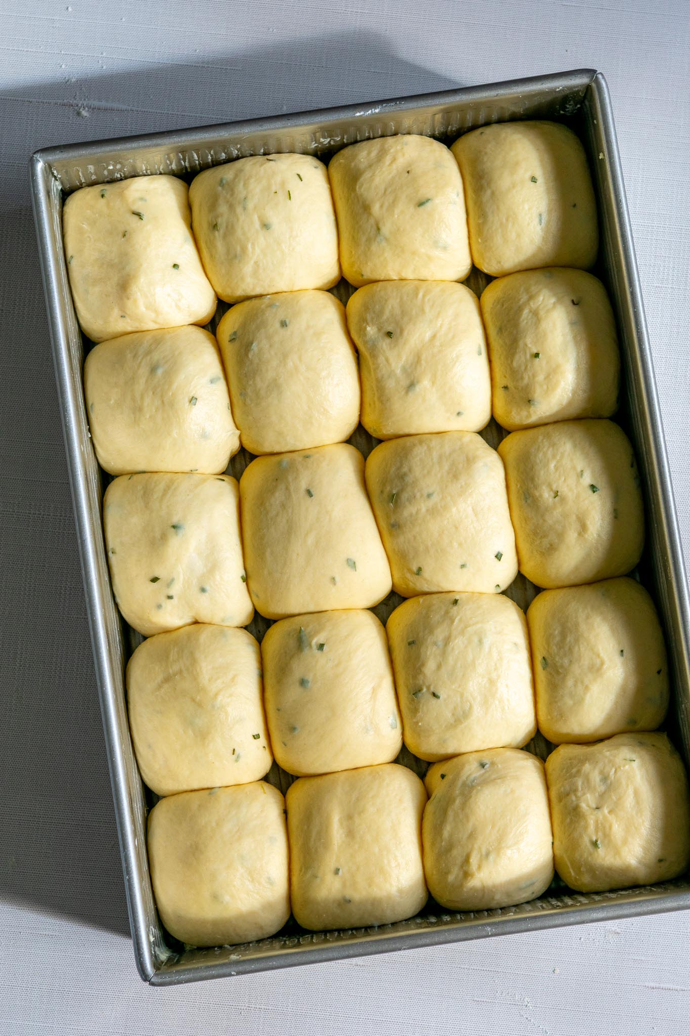 Final proof of sourdough dinner rolls in pan