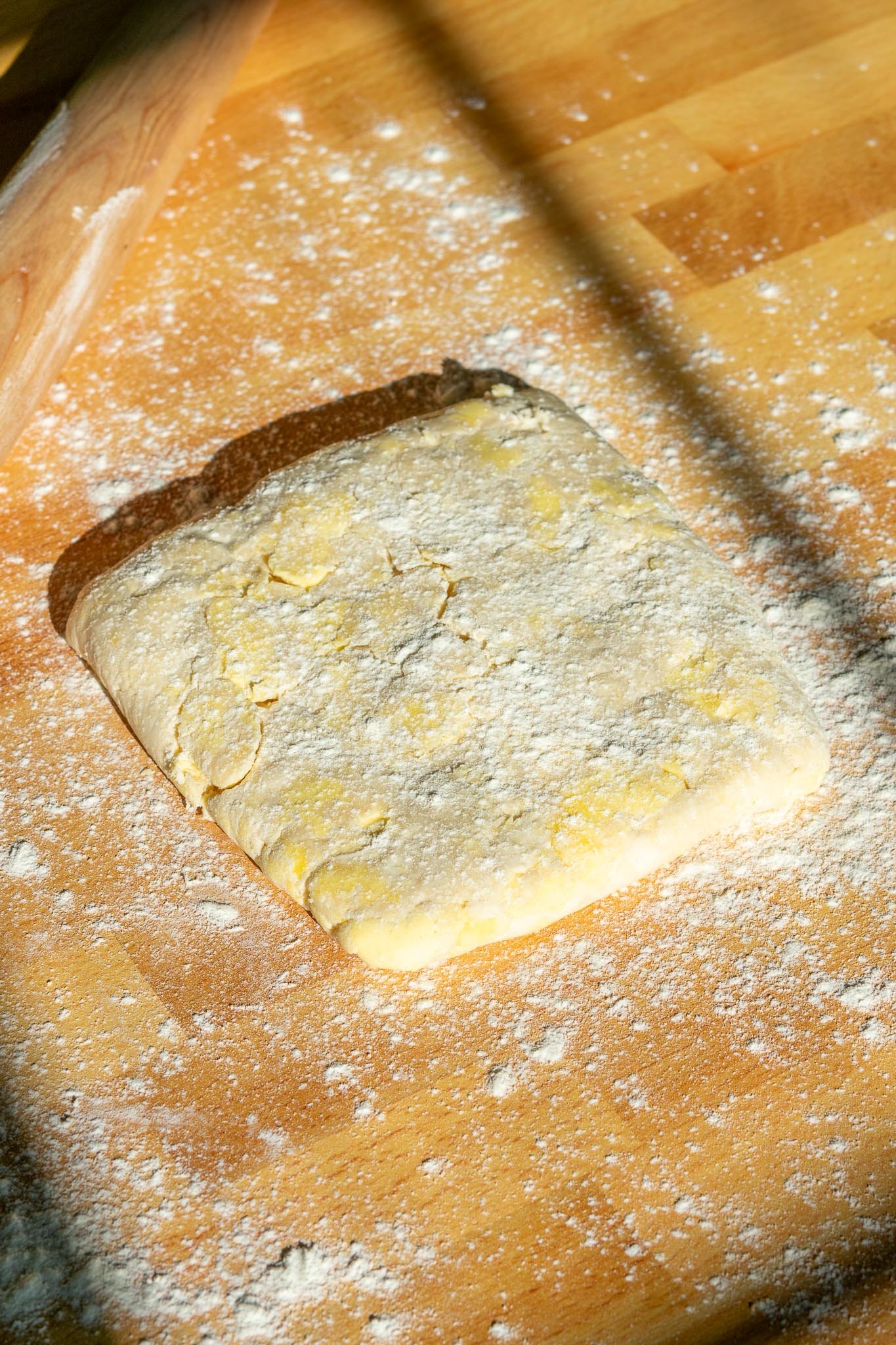 Sourdough pie crust dough with flour and rolling pin