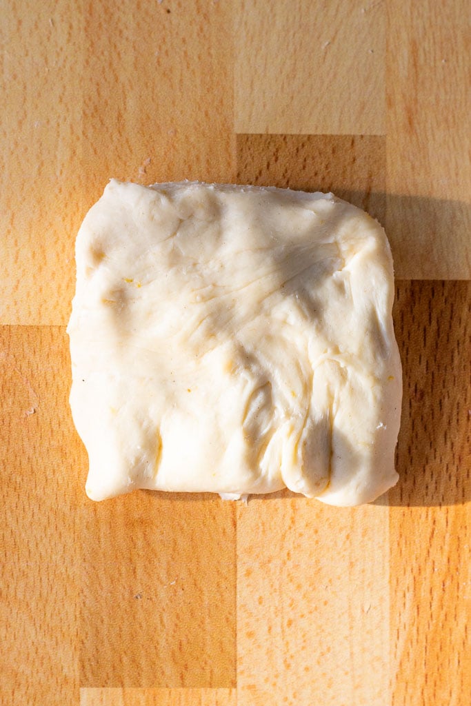 Brioche dough flattened into a square