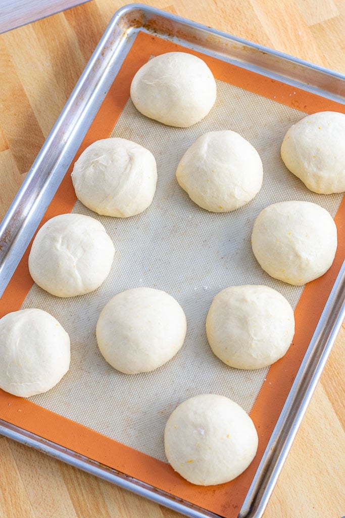 Sourdough maritozzi at the end of proofing on a baking sheet