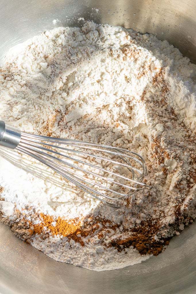 Whisking dry ingredients for sourdough banana bread together in bowl