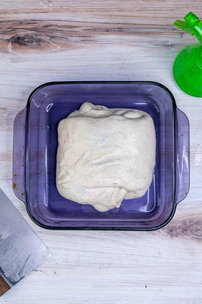 Laminated dough folded into a package in a Pyrex dish.