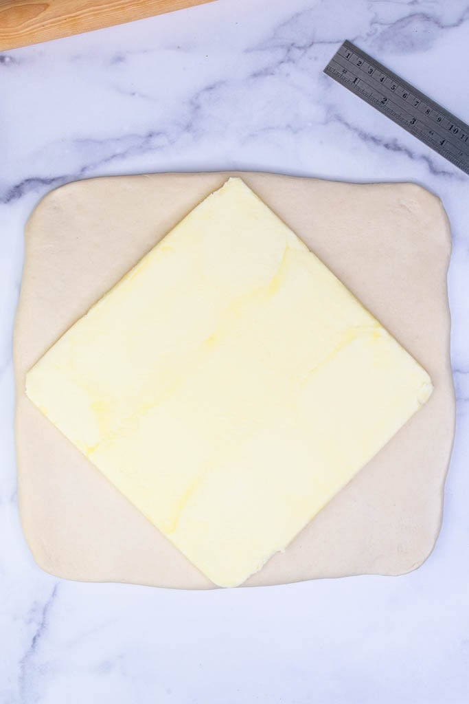 Diamond butter block on top of square croissant dough